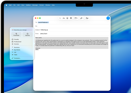 MacBook Air screen showing Apple Intelligence Writing Tools composing an email