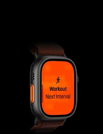 Apple Watch Ultra 4, titanium case, black colour, Running workout, next interval, left side exterior, orange Action button, Alpine Loop strap