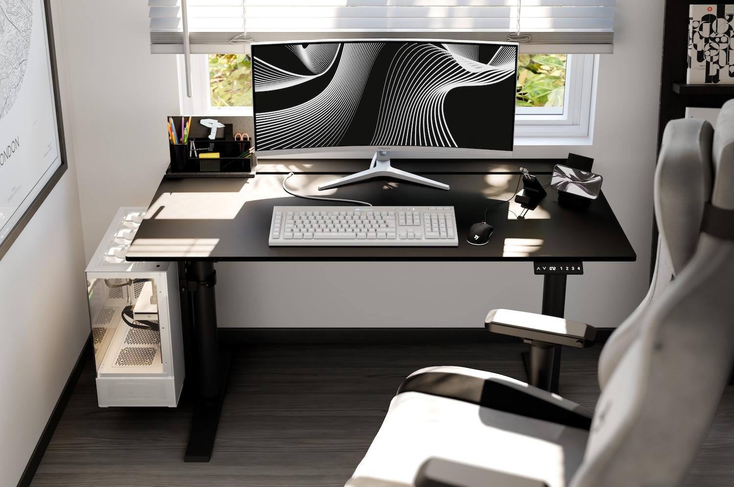 A desk set up with a computer, with a chair in front of it