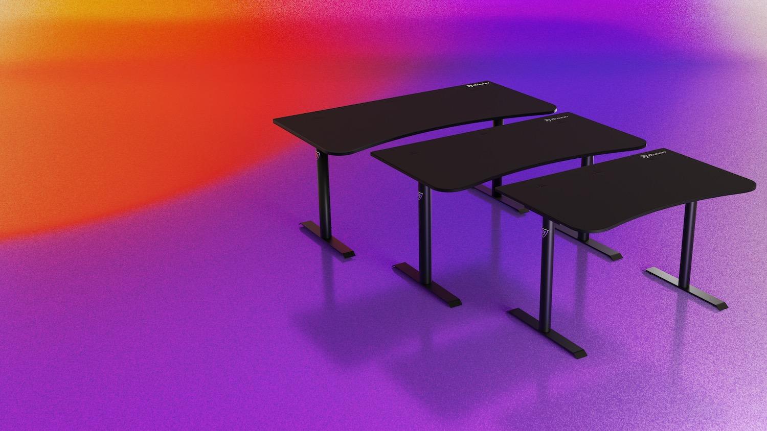 Three black tables lined up on a bright coloured background