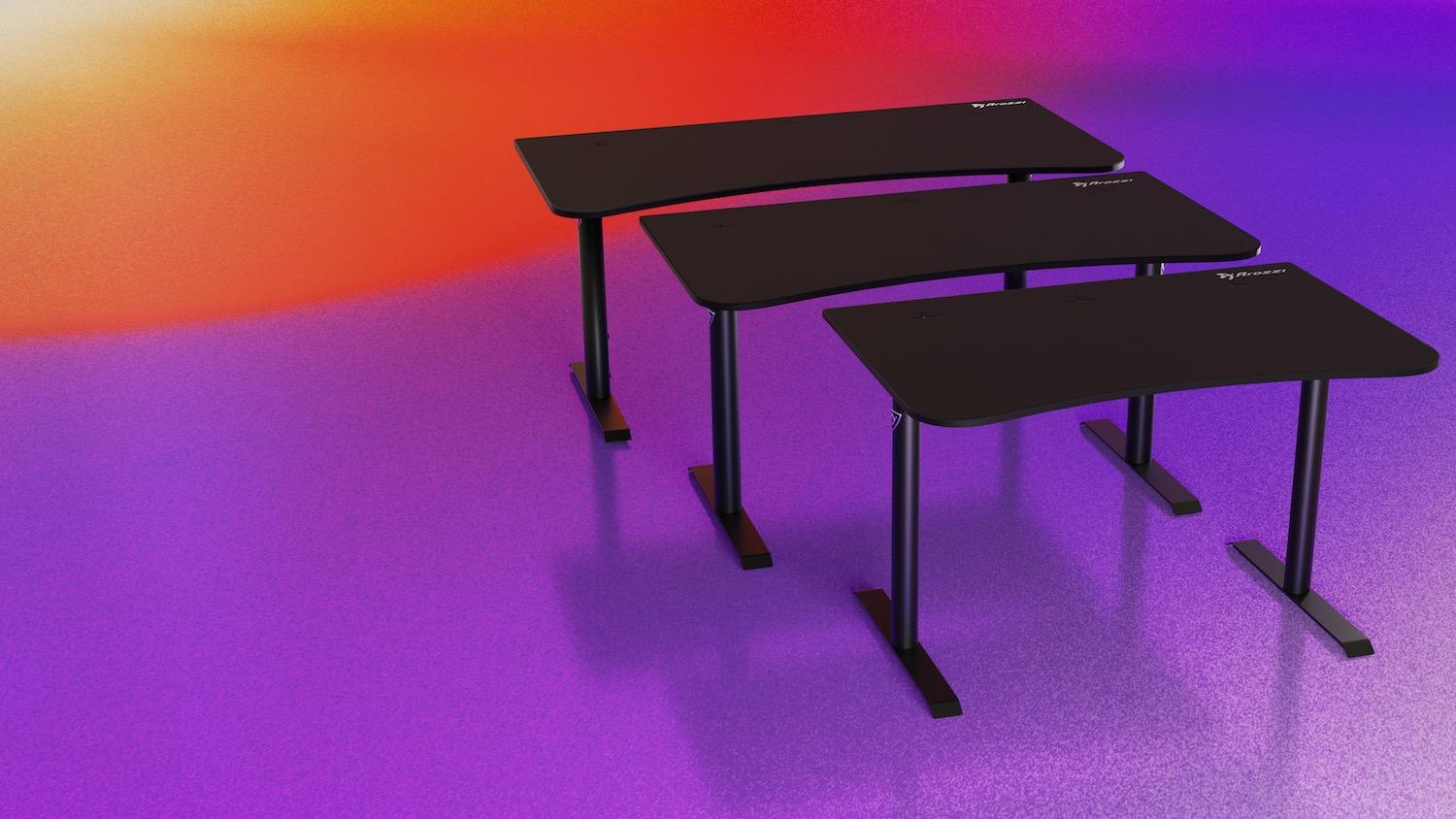 Three black tables lined up on a bright coloured background