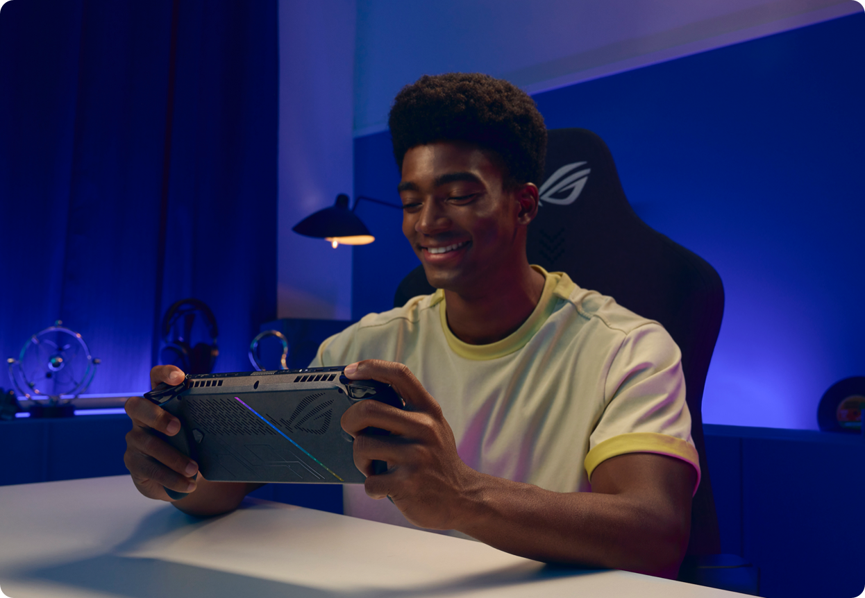 a man sitting at a table with a tablet in front of him