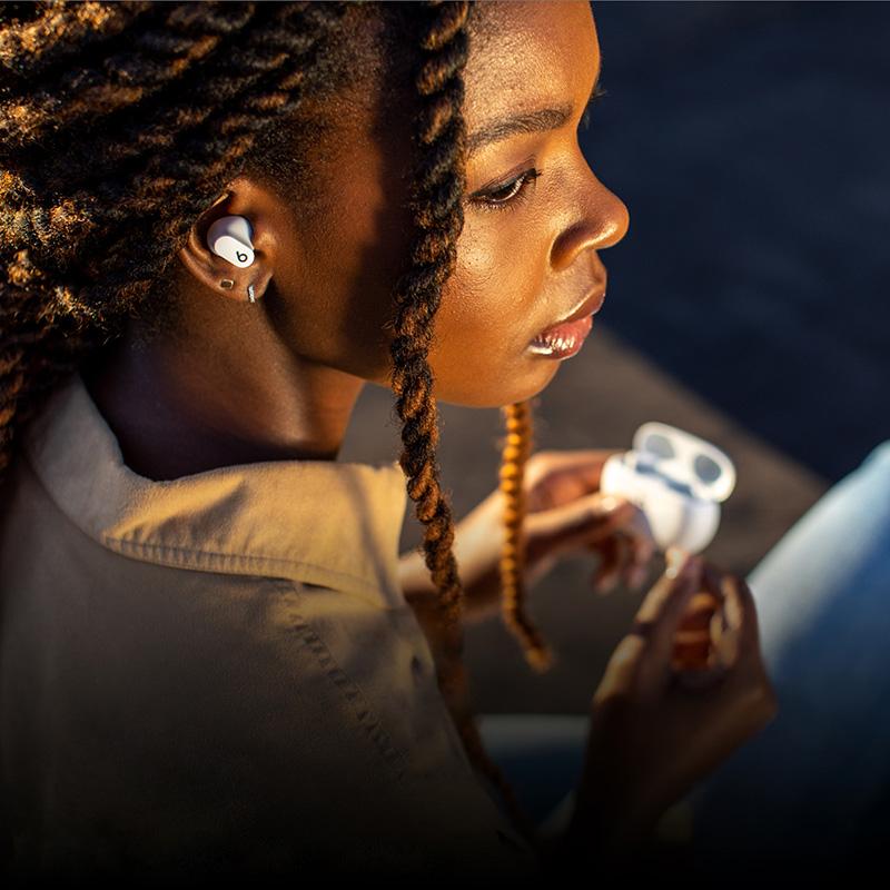 beats studio buds earphones worn by a model