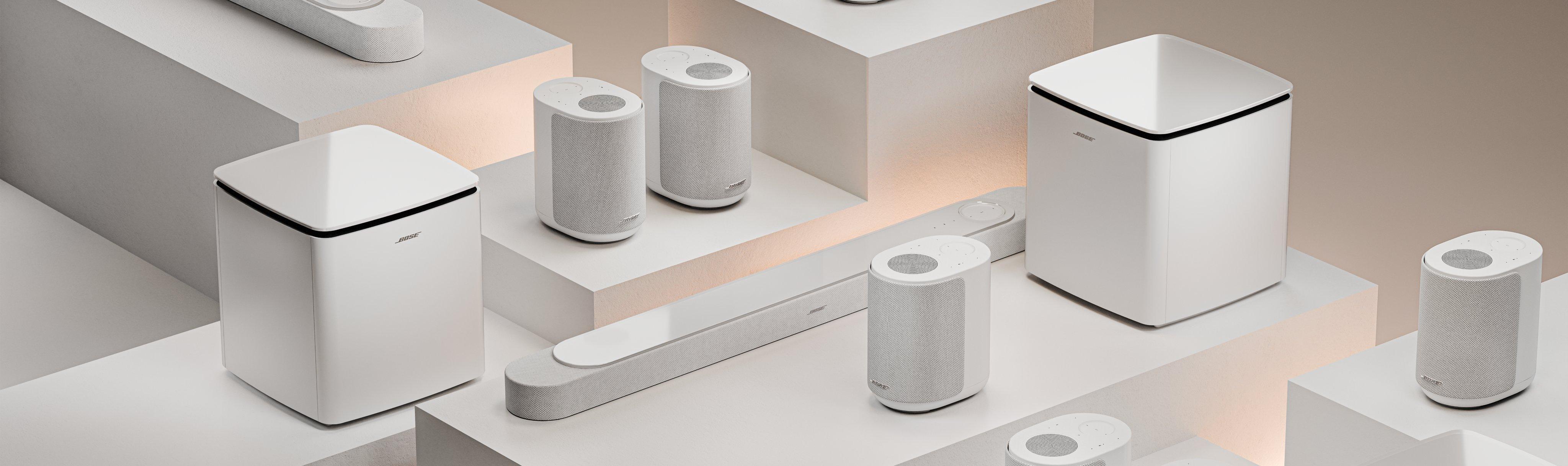 A collection of white speakers, subwoofers and soundbars