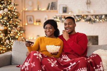 Man and Women Watching TV
