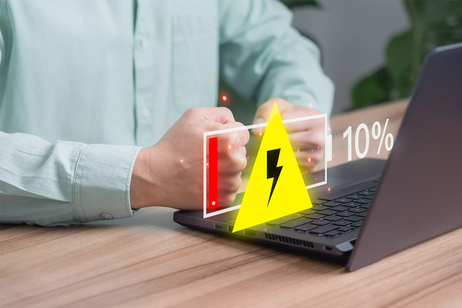 An image showing a laptop screen with a large graphic overlay indicating a low battery