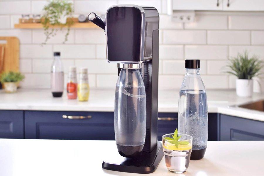 A drinks maker on a counter in a kitchen