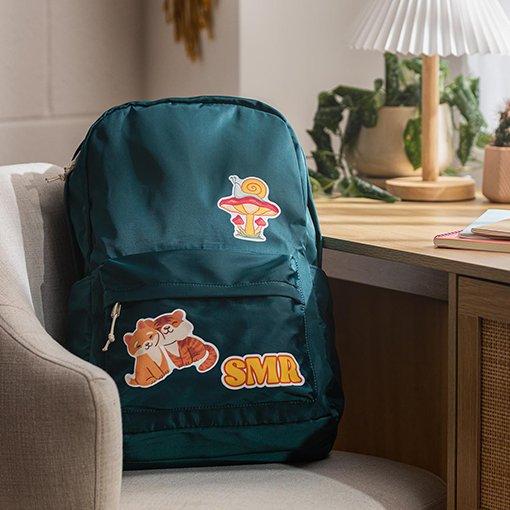 A backpack with cartoons printed on it