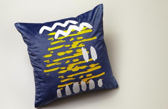 A cushion with an abstract pattern on it