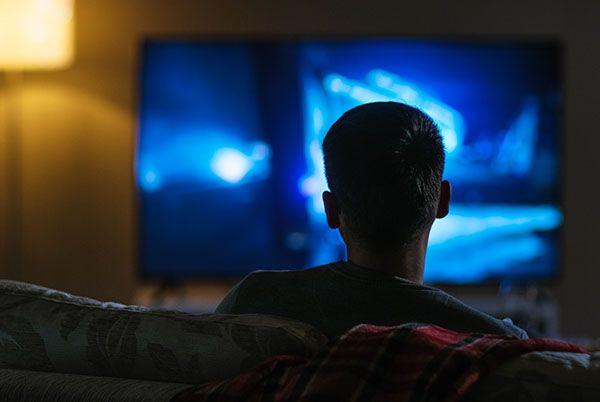 Watching TV in a dark room