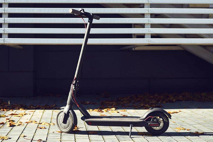 An electric scooter on a pavement