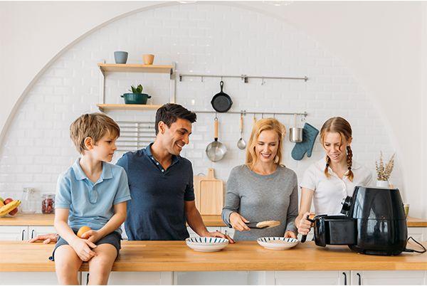 family using air fryer