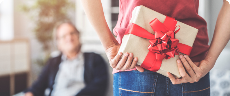 Someone holding a present behind their back