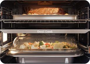 Roast meat and vegetables cooking in separate compartments