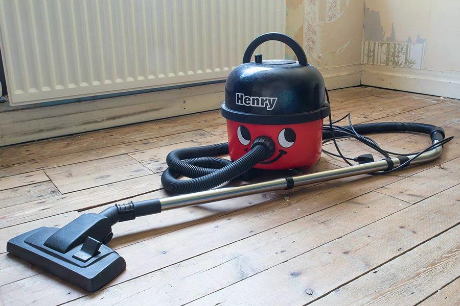 The end of a vacuum cleaner washing carpet