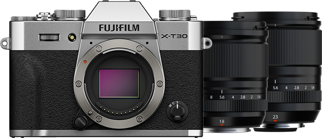 A Fujifilm camera next to two lenses