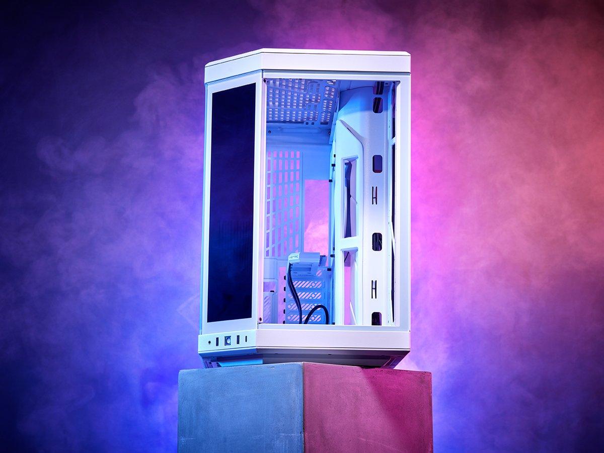 A PC fan sitting on top of a concrete block surrounded by a purple glow