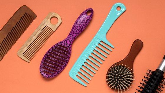 a variety of hair combs and brushes