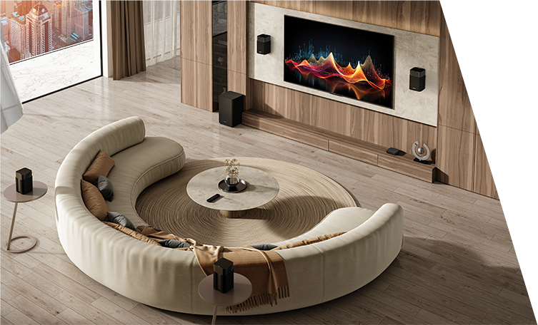 A living room with a large rounded sofa facing a TV with a fire on the screen