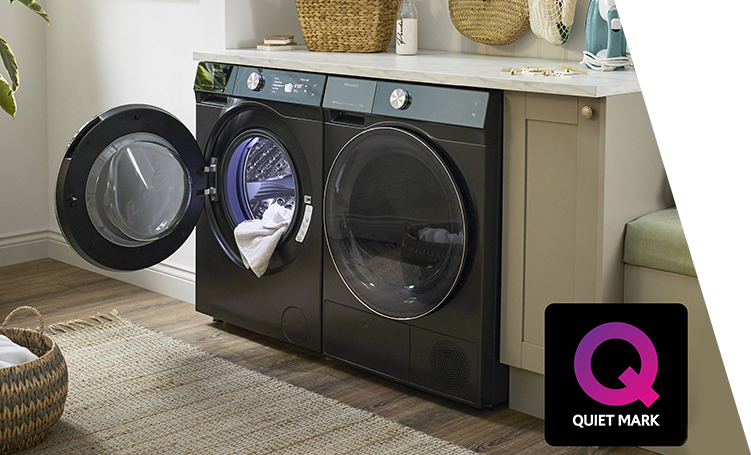 A washing machine and a tumble dryer side-by-side under a counter