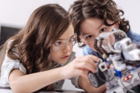 Kids playing with robot toy