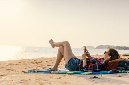 Using phone on beach