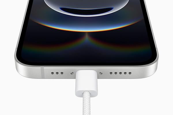 a close up of an iphone 16e usb c connector with cable plugged in