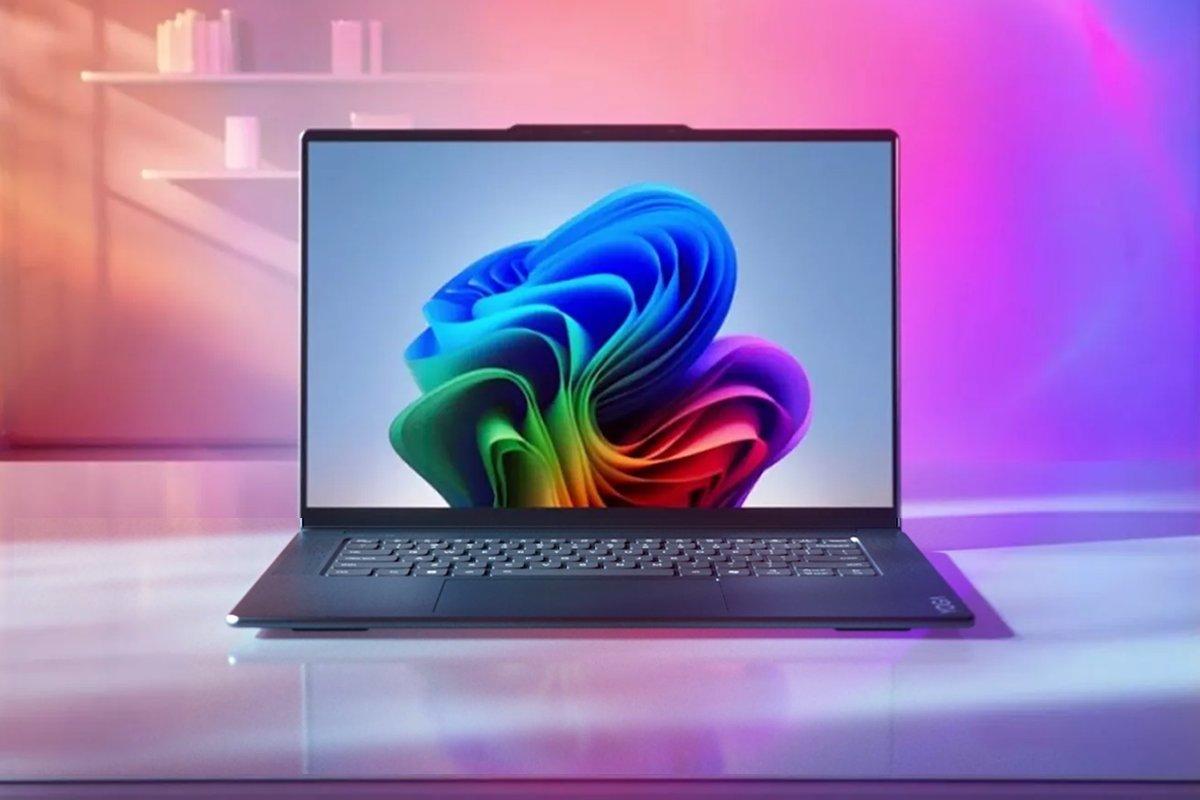 A Lenovo laptop sits open on a surface