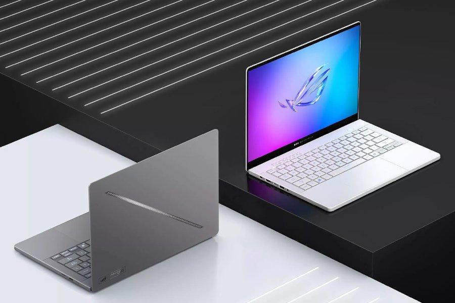 Two laptops on a grey and black background