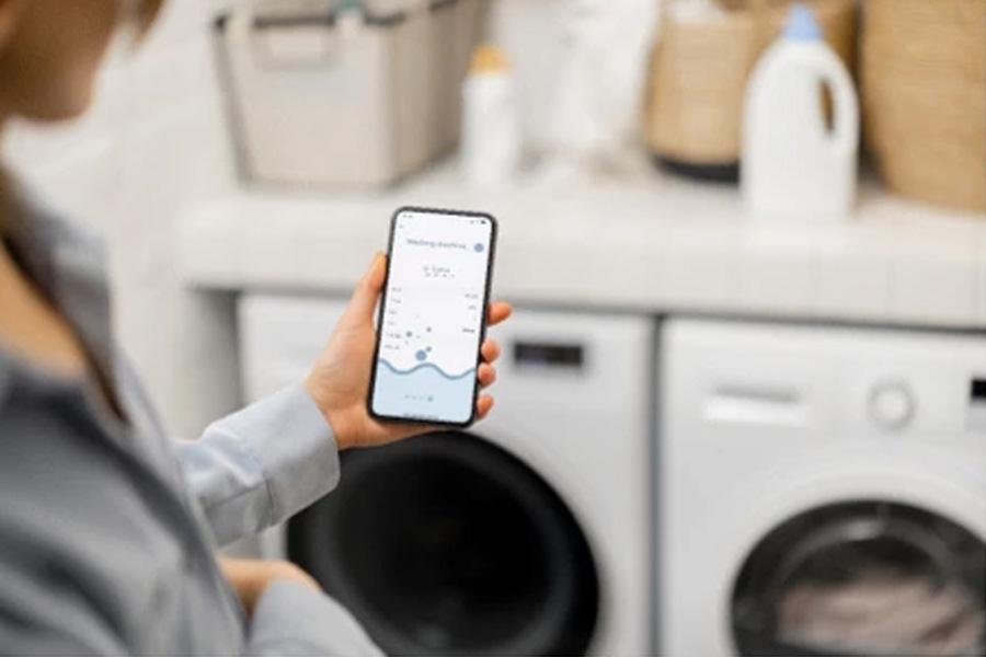 Family in kitchen with washing machine