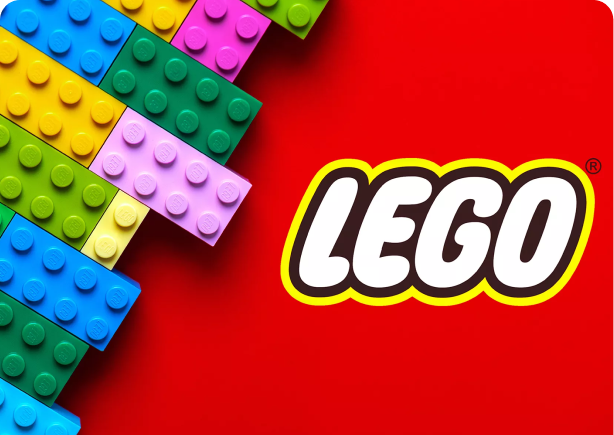 The LEGO logo on a red background next to stacked LEGO blocks