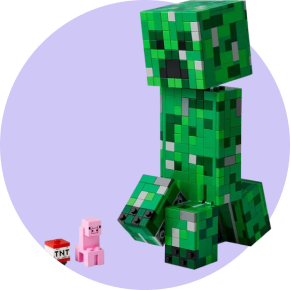 A LEGO Minecraft creeper standing next to a pig and TNT block