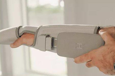 an arm with a compression massage device on it