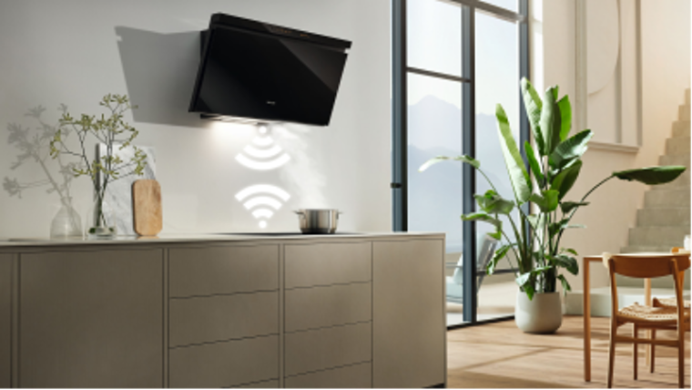A cooker hood over a hob with wifi signals pointing at each other