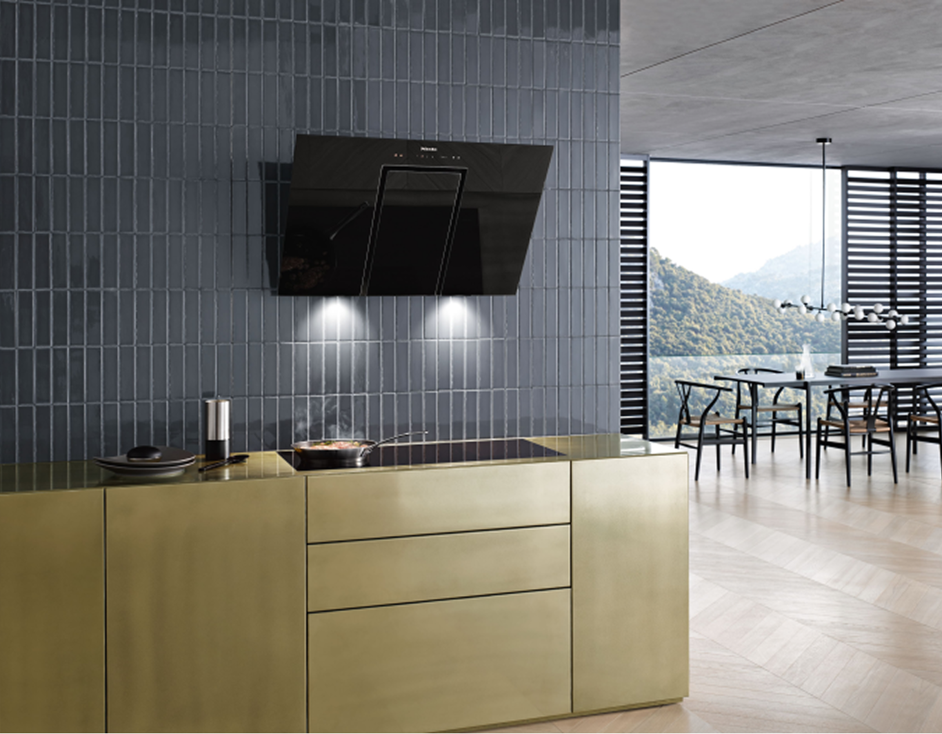A cooker hood on a wall above a hob in a kitchen