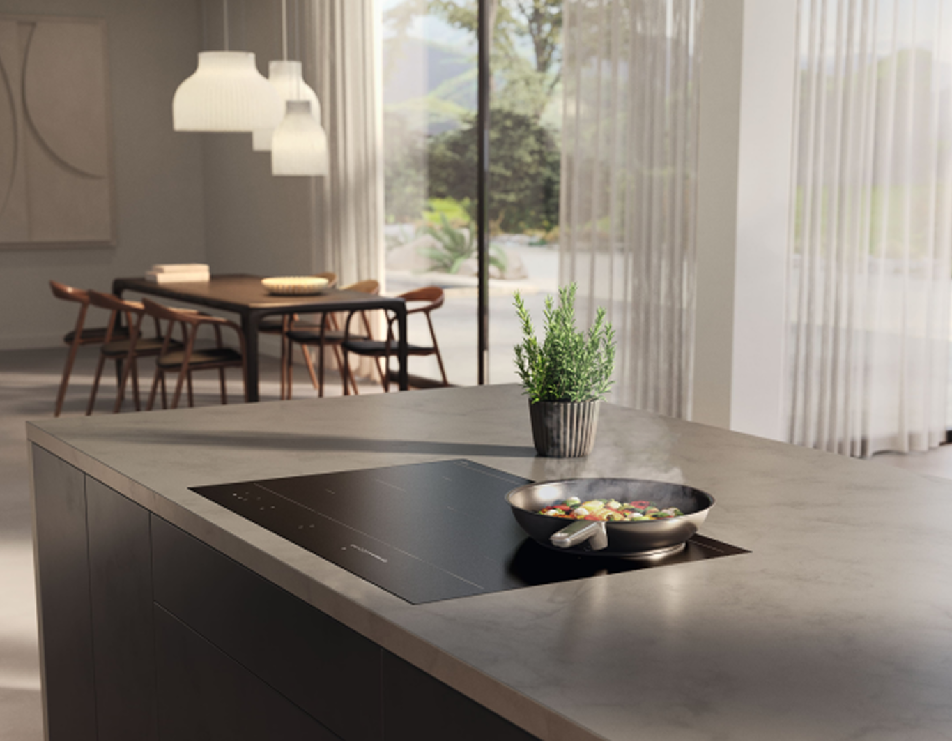 A modern kitchen with a focus on a built-in hob with a frying pan on it