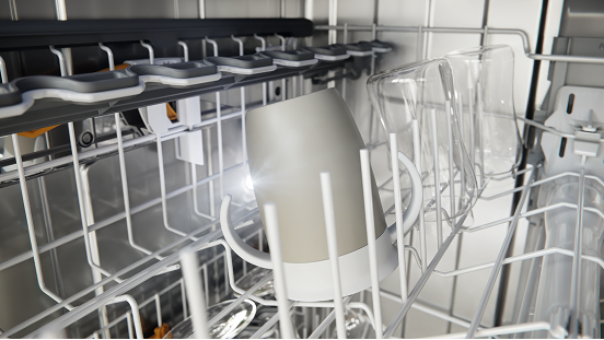 Inside a dishwasher, with a mug in the rack