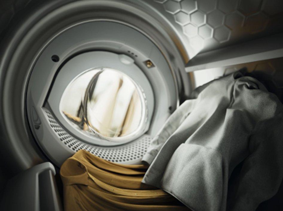 Inside a tumble dryer drum with clothes in