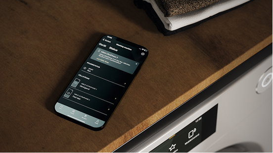 A smart phone lying on a counter