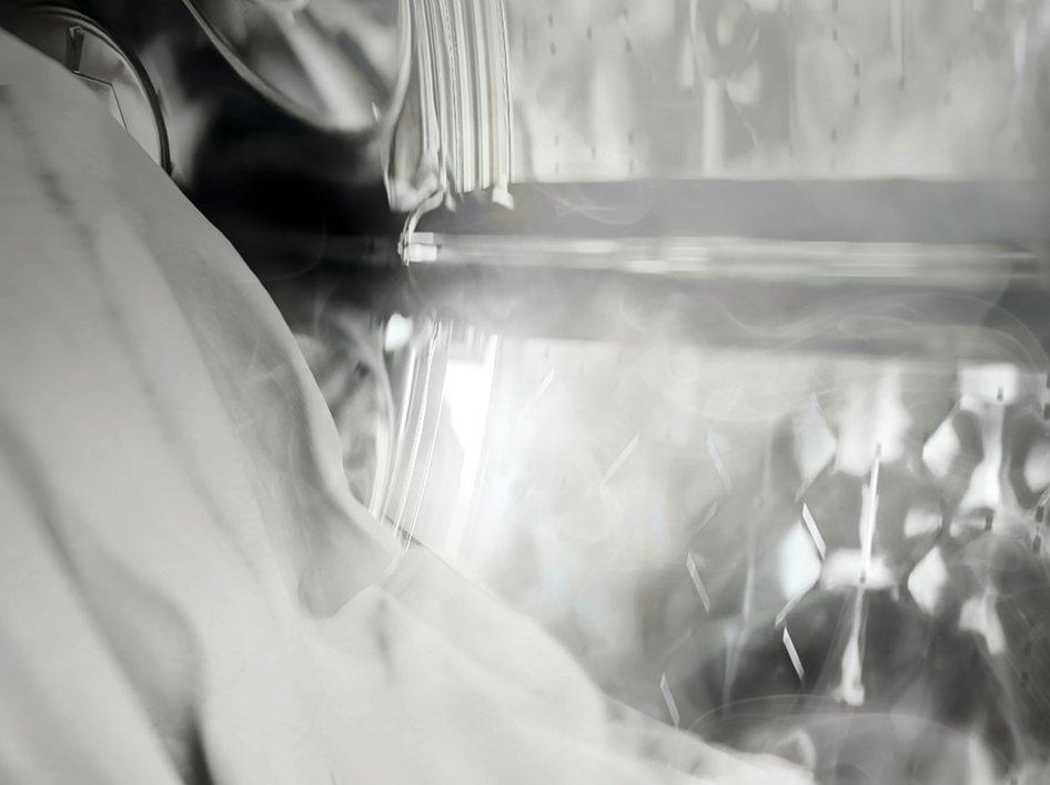 A washing machine drum with steam in it