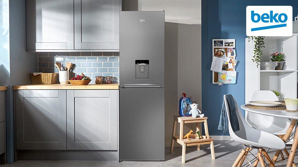 A kitchen with a silver Beko fridge freezer in the middle