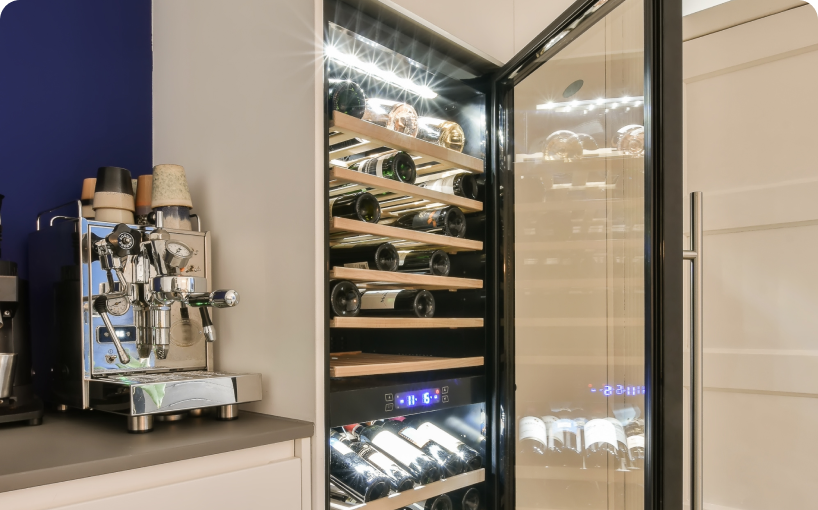 A wine cooler full of wine bottles in a kitchen