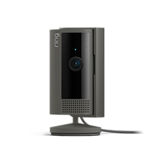 A Ring security camera on a white background