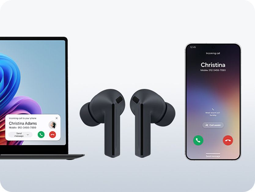 A laptop, a phone and earbuds