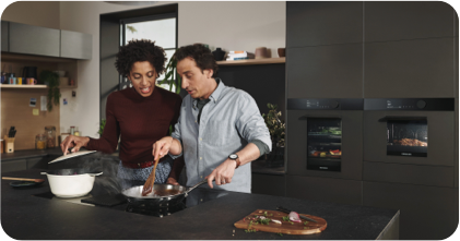 an image of a man and woman cooking