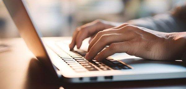 Person typing on laptop