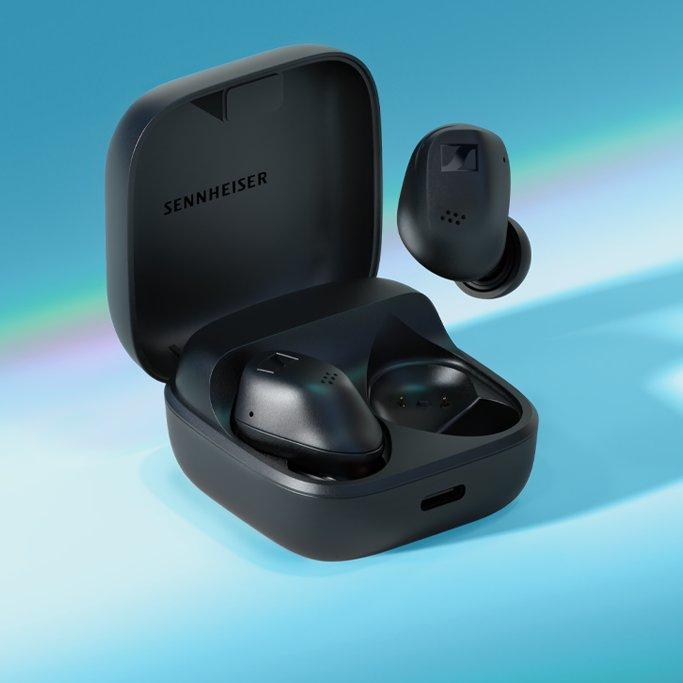 A set of black earbuds in a case with Sennheiser written inside