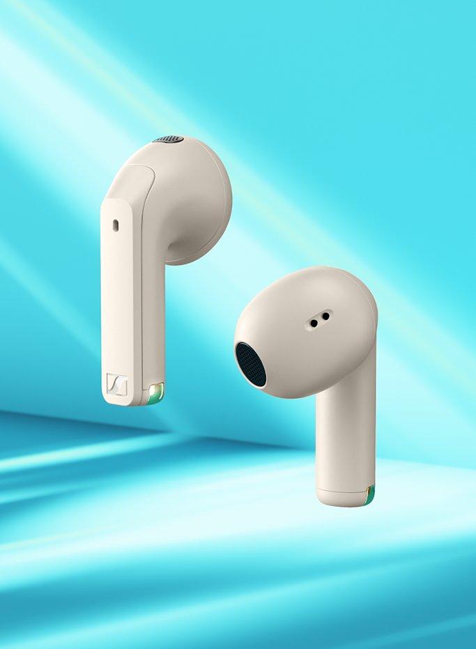 A set of whitre earbuds floating on a blue and white background