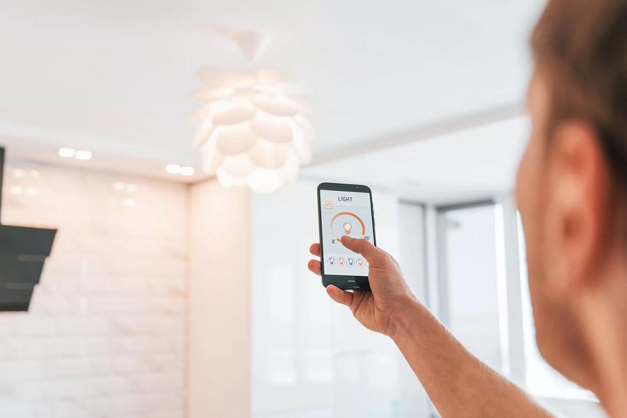 Men controlling lights with their phones