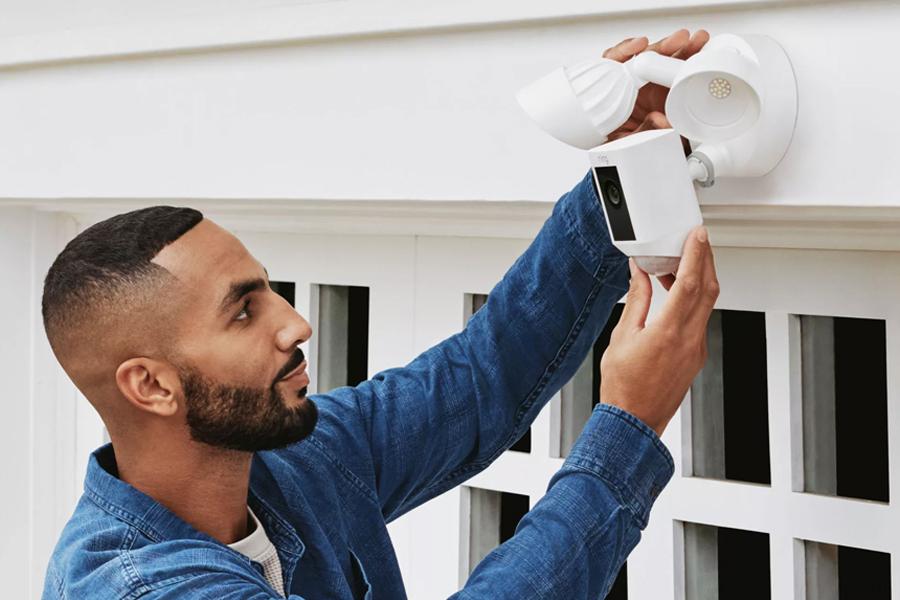 Men installing security camera